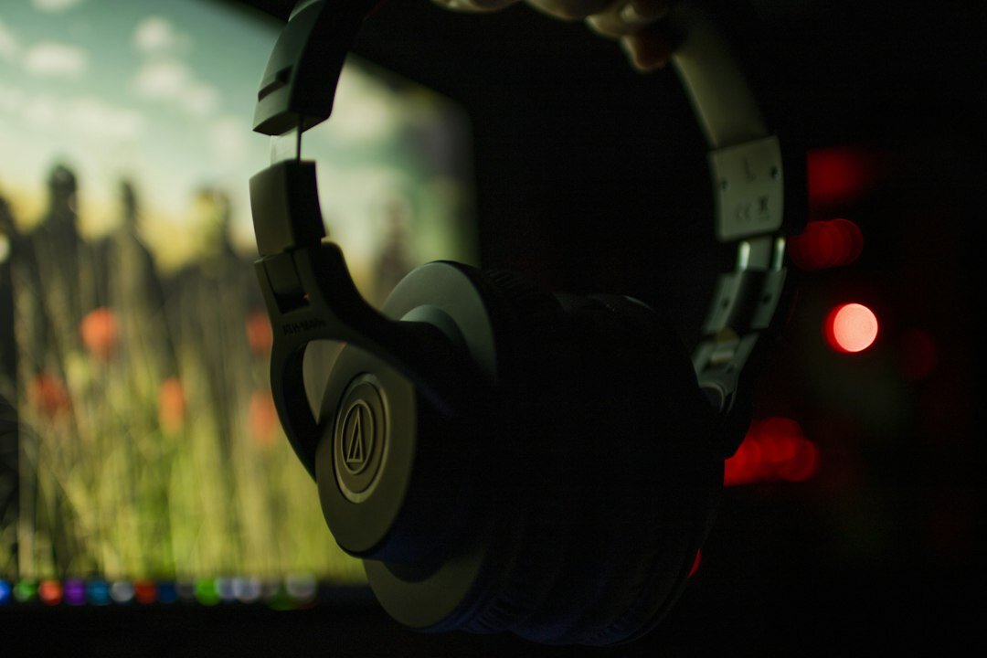Broadcast producer wearing a headset in a studio gallery