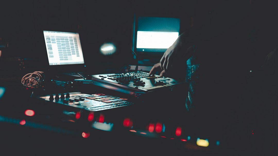Female broadcast engineer working at a vision mixing desk
